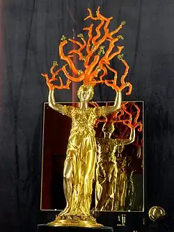 Statuette of Daphné by Wenzel Jamnitzer (1569–76). Gilded silver and coral.