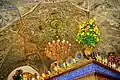 Decor and carvings underneath the central dome; the top of the zarih is visible