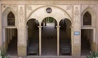 An exterior view of lower-floor hallways inside the Abbāsi House.