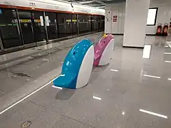 Dolphin couple stools, located on the platform