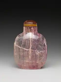 A small snuff bottle made out of Amethyst