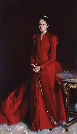 A woman with a red dress and brown hair