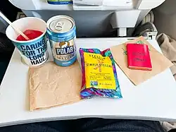 An in-flight snack on a tray table