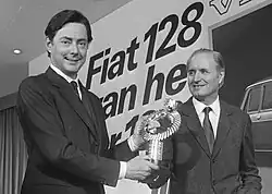 Umberto Agnelli and Dante Giacosa holding the 1970 European Car of the Year award for the Fiat 128 (5 February 1970).