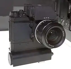 Apollo 15 (NASA) Nikon F with FTn Photomic prism and motor drive, usable for extra-vehicular activity. The first 35 mm SLR in lunar orbit.