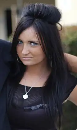 Image 149The signature early 2010s “pouf” hairstyle, featuring teased crown volume and long, straightened hair inspired by Snooki from MTV’s Jersey Shore, 2010. (from 2010s in fashion)