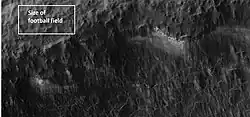 Close-up of a portion of a crater wall indicated in the previous photo. There seems to be grooves in the wall.