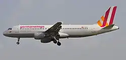 A jet aircraft taking off, nose up, viewed from the side, the livery spelling out "Germanwings"