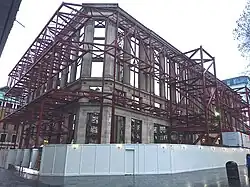 The facade of 48 Leicester Square stands alone in January 2015, after demolition of the building behind it. Originally Fanum House, designed by Andrew Mather and built in three phases 1923-26, 1936–37 and 1956–59