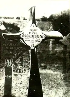 Crucifix, made from an aeroplane propeller, in a cemetery. The inscription reads "Lt. Col. R.S. Dallas DSO DSC ... Killed in Action"