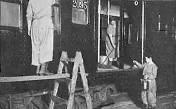 Women in a car shop clean and repaint an AB Standard c. 1917–1918