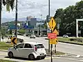 A bunch of Malaysian road signs on Federal Route 195 Seremban–Bukit Nenas Highway