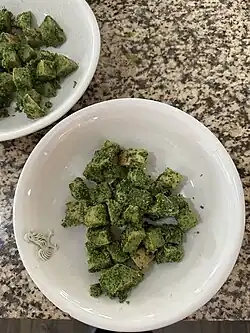 Bread is coated in cilantro-garlic paste and portioned into individual bowls