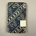 Blue paste paper with impressed designs used as a book covering, c. 1782