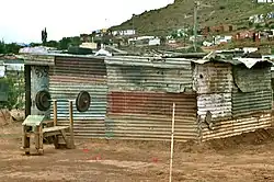 A bigger shack made of corrugated iron within Dukathole