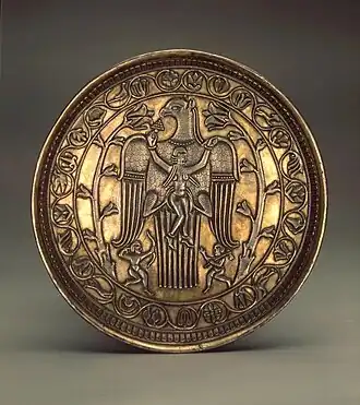A similar scene on a Sassanid silver plate from the 7th century; decorated with an eagle carrying a woman, the plate was found in Cherdynsky District in the Soviet Union in 1934, now in the Hermitage Museum in Saint Petersburg.