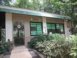A building surrounded by trees.