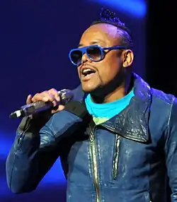 A photograph of apl.de.ap performing