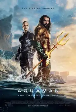 Aquaman and Orm standing together in water on a beach coast with the tagline "The Tide is Turning" above them and the logo below.