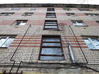 Brickwork made of ceramic and silicate bricks, stairwell windows of building 1-447 in Arzamas