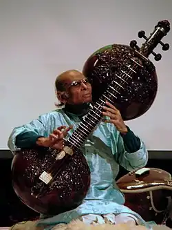Rudra veena is a large plucked string instrument used in Hindustani classical music. One of the major types of veena played in Indian classical music, it has two calabash gourd resonators.[47] The vichitra veena, also with two large resonators, is a similar instrument.