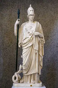 A Roman copy of a Greek original statue of Athena. She is depicted in her traditional armor and cloak with a snake at her right foot. She is holding a spear in her right hand.