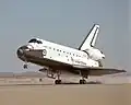 Atlantis touches down at the lakebed runway at Edwards Air Force Base.