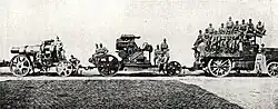Barrel, body and crew towed by an M 12 tractor, c. 1914