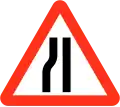 Road narrows on left sides