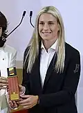 Putellas receiving the Medalla d'Honor del Parlament de Catalunya on behalf of Barcelona Femení in 2023