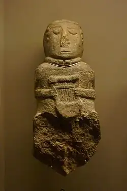Statue of a bard with a Gallic lyre, found at the Paule oppidum, France