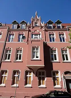 Bay window onto Garbary street, topped with pinnacles