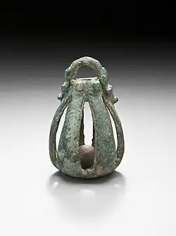 Western Iran, circa 1000-650 B.C. Bronze bell, 2 5/8 x 1 5/8 inches.