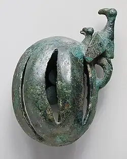 Western Iran, circa 1000-650 B.C. Bronze, cast bell, 2 3/8 x 3 7/8 inches.