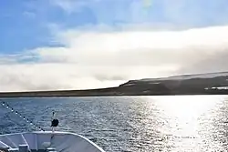 Bennett Island – M/S Hanseatic anchoring in the roads at the north coast
