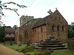 St John the Baptist parish church, with its unusual wooden porch at left