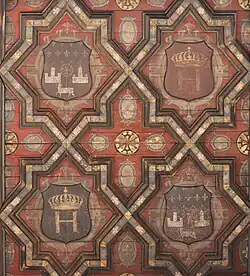 Henry IV courtyard, coats of arms under the awning. The geometric motifs evoke the Mudejar style, but also Serlio's engravings (redesigned after the Renaissance).