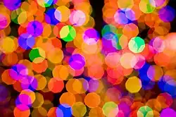 An example of the bokeh produced by the Canon 85 mm prime f/1.8 lens. The polygonal shapes are due to the 8-bladed aperture diaphragm being slightly closed. At its full aperture (f/1.8) these shapes would be smooth and not polygonal.