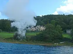Image 73Brantwood, overlooking Coniston Water, viewed from the steam yacht 'Gondola' – note the angled, corner windows designed to take in the views (from History of Cumbria)
