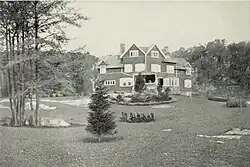 A shingled three-story house