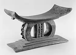 a black and white image of an Akan stool