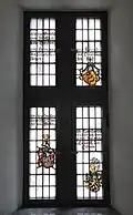 Stained glass coats of arms in the great hall windows