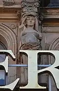Caryatid (right), pediment over Bay 4, South Saint David Street façade