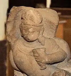 Samkarsana-Balarama under his snake hood holding a cup