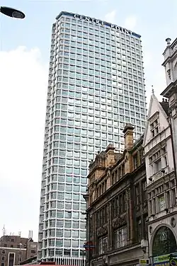 A tower block surrounded by shorter buildings