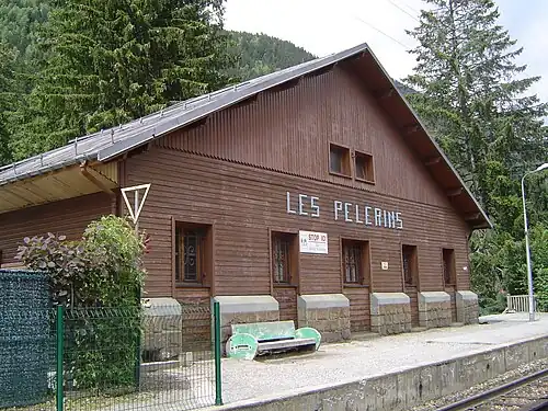Wooden two-story building with gabled roof