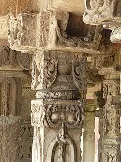 A color photograph of some pillars built with stone and ornamented with various designs