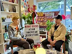 Chew at an AANHPI Heritage Month event at Cambodian American bookstore mam's books in the CID