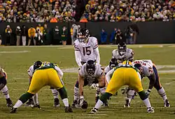 A photo of two football teams lined up against each other during a game