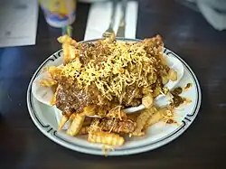 French fries topped with chili con carne and cheese
